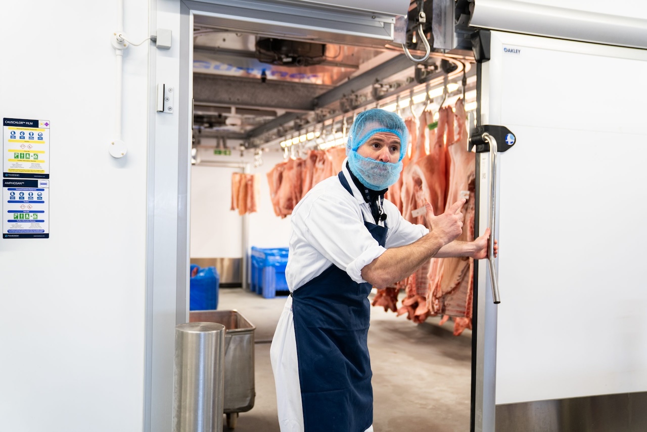 Carcasses hanging on an AES meat rail system at HG Walter